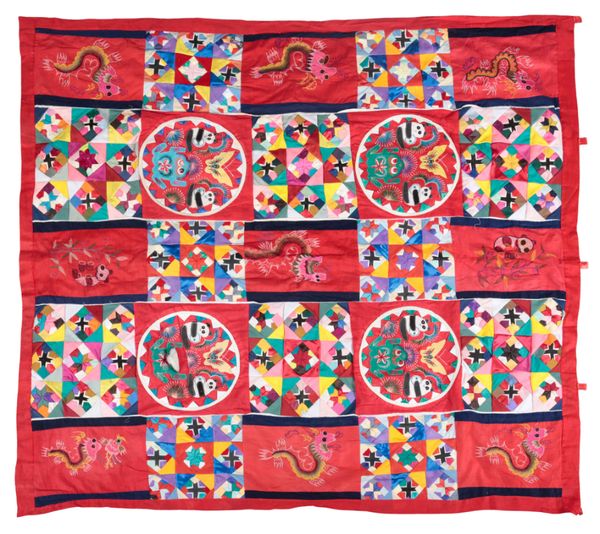 A QUILTED AND EMBROIDERED REVERSIBLE WALL HANGING