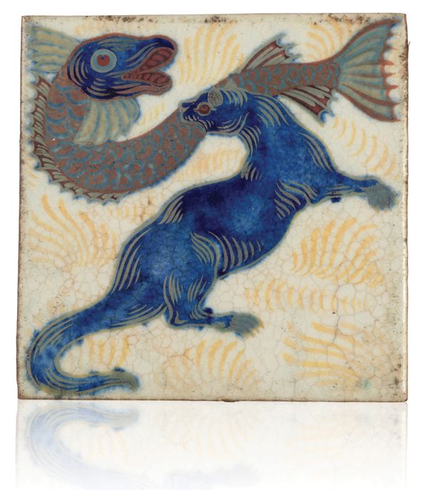 WILLIAM DE MORGAN (1839-1917): A RARE 'TRIPLE LUSTRE' LATE FULHAM PERIOD TILE 'OTTER WITH FISH'