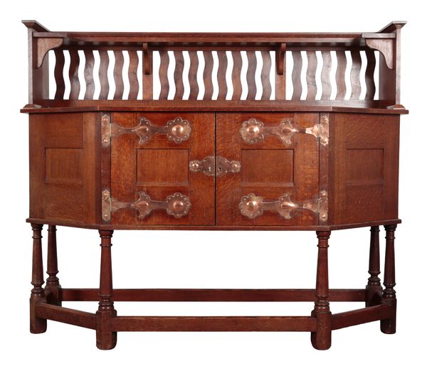 ATTRIBUTED TO LIBERTY & CO: AN ARTS AND CRAFTS OAK SIDEBOARD