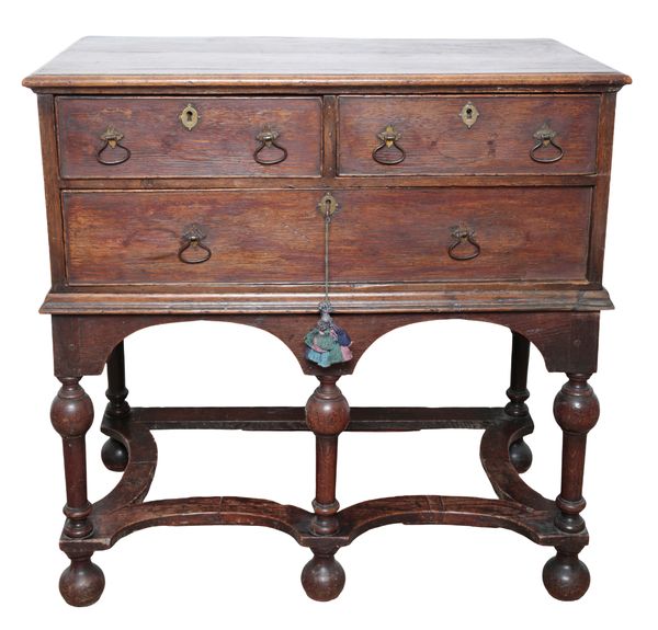 AN OAK CHEST ON STAND