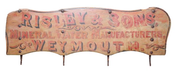 A PAINTED-WOOD ADVERTISING SIGN: 'RISLEY & SONS, MINERAL WATER MANUFACTURERS, WEYMOUTH'