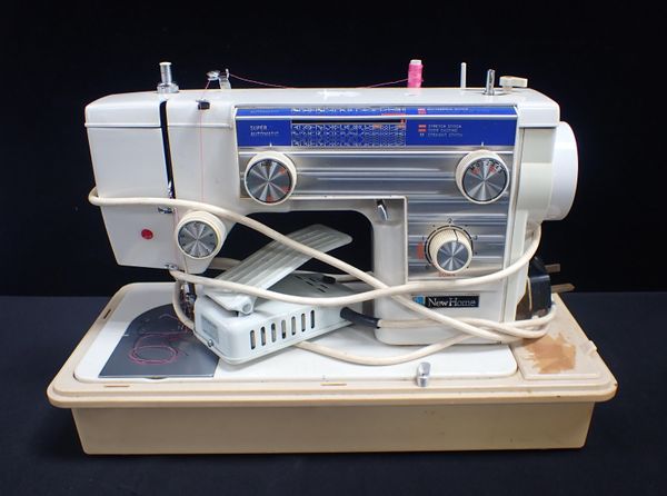 A NEW HOME 'SUPER AUTOMATIC' SEWING MACHINE