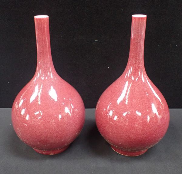 A PAIR OF CHINESE RED GLAZED BOTTLE VASES