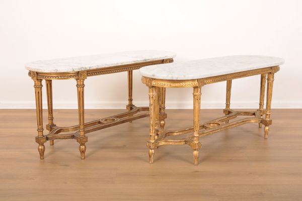 A MATCHED PAIR OF LOUIS XVI STYLE GILTWOOD LOW TABLES