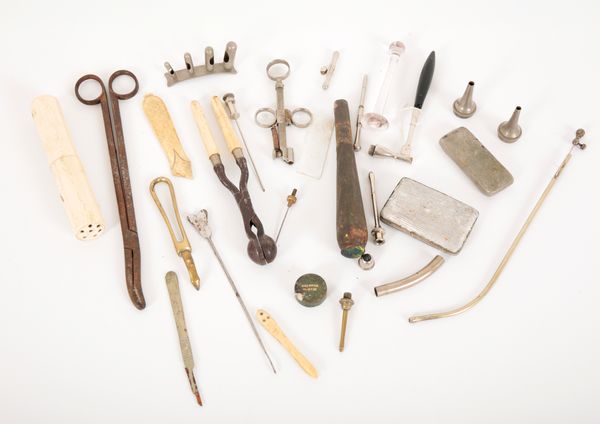 A COLLECTION OF MEDICAL TOOLS OR IMPLEMENTS