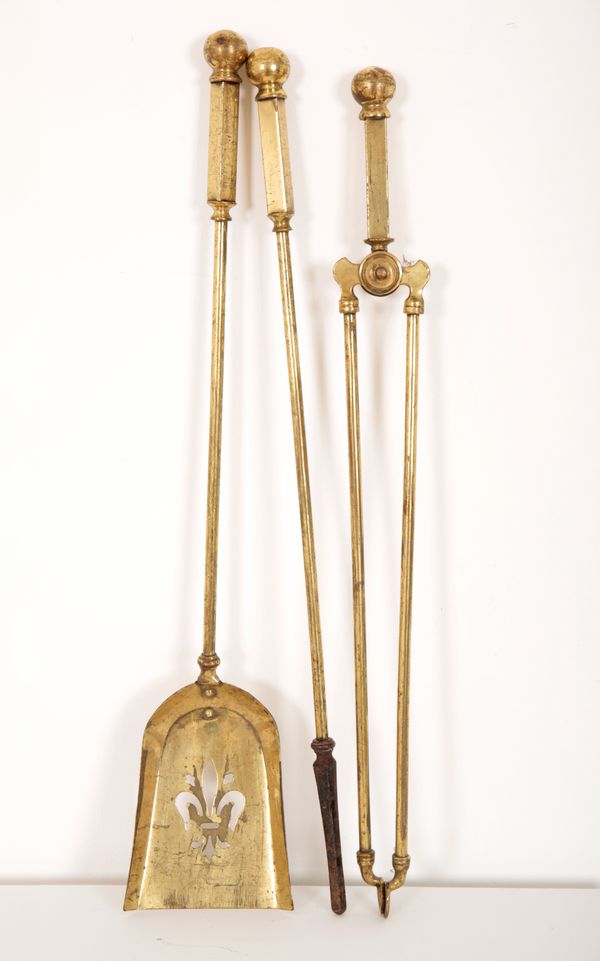 A SET OF BRASS AND IRON FIRESIDE TOOLS