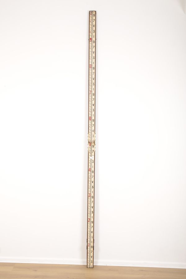 A SURVEYOR'S BI-FOLDING MEASURING STICK