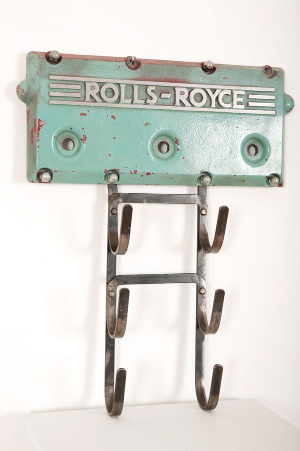 A ROLLS ROYCE ENGINE ROCKER COVER CONVERTED TO COAT HANGER