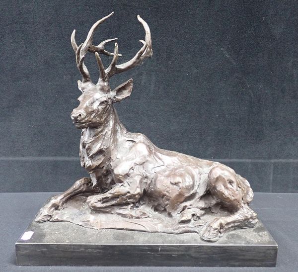 HOLLOW CAST BRONZE SCULPTURE OF A SEATED DEER