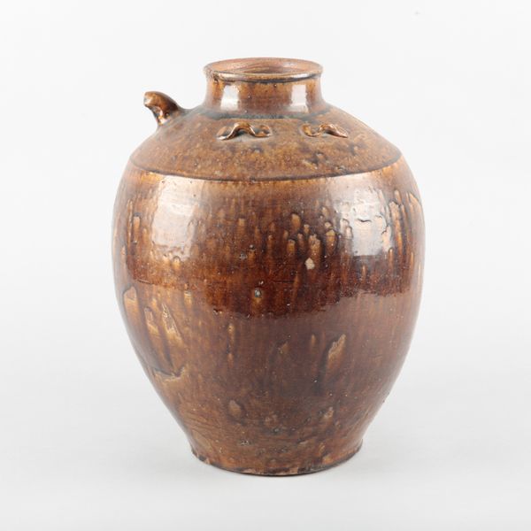 A LARGE CHINESE MARTABAN BROWN-GLAZED STORAGE JAR