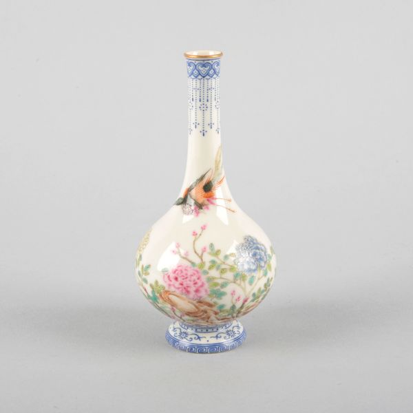 A SMALL CHINESE PORCELAIN FAMILLE ROSE BOTTLE VASE