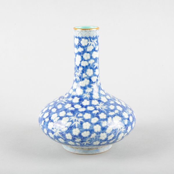 A CHINESE POWDER BLUE 'ICE CRACK' GLAZE BOTTLE VASE