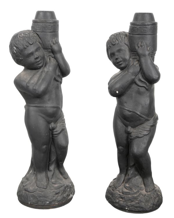 A PAIR OF BLACK PAINTED COMPOSITE CHERUBS