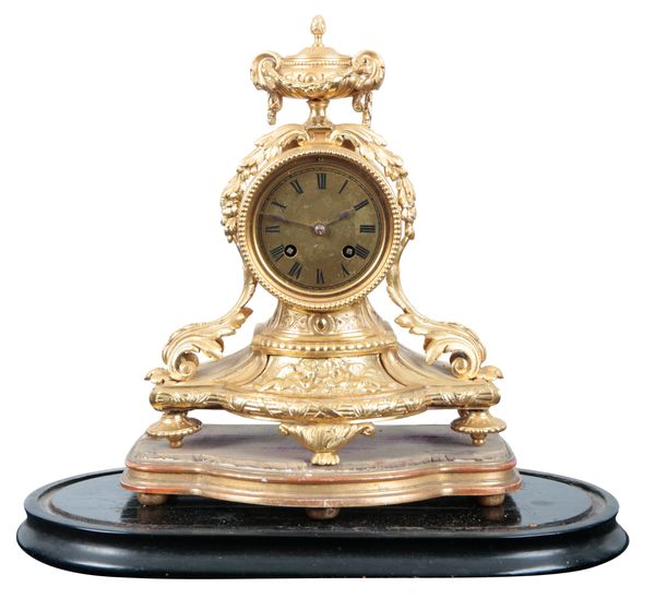 A FRENCH GILT METAL MANTEL CLOCK