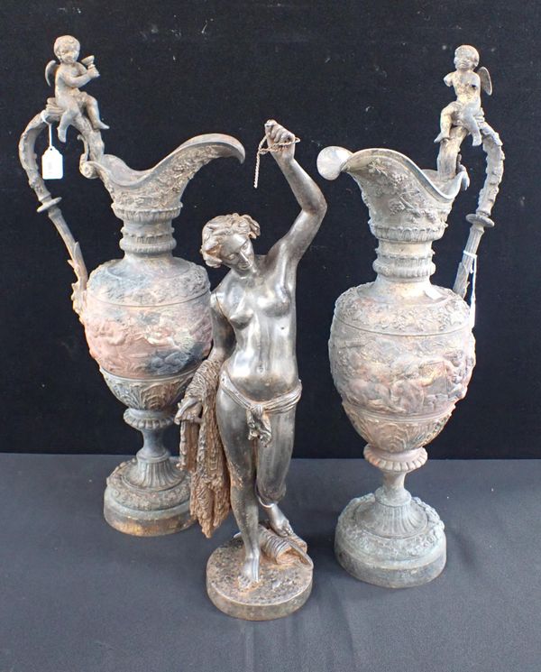 A PAIR OF CAST METAL RENAISSANCE STYLE EWERS WITH CHERUB HANDLES