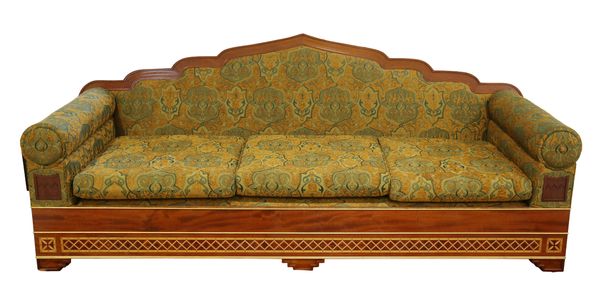 A HARDWOOD FRAMED THREE-SEATER SOFA WITH ARCHED MORESQUE BACK RAILS