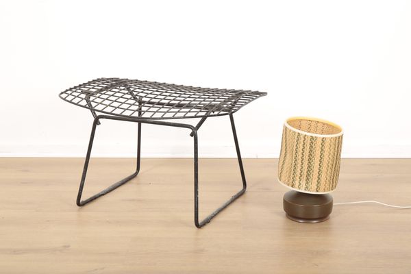 A MID CENTURY BLACK METAL STOOL