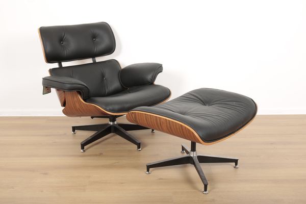 A REPRODUCTION EAMES LOUNGE CHAIR AND STOOL