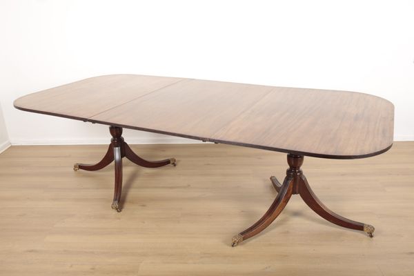 A GEORGE III STYLE MAHOGANY DINING TABLE