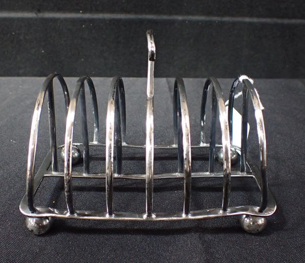 A VICTORIAN SILVER TOAST RACK, LONDON 1887