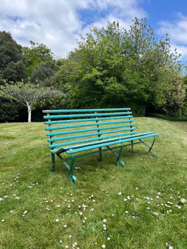 A GREEN-PAINTED GARDEN BENCH