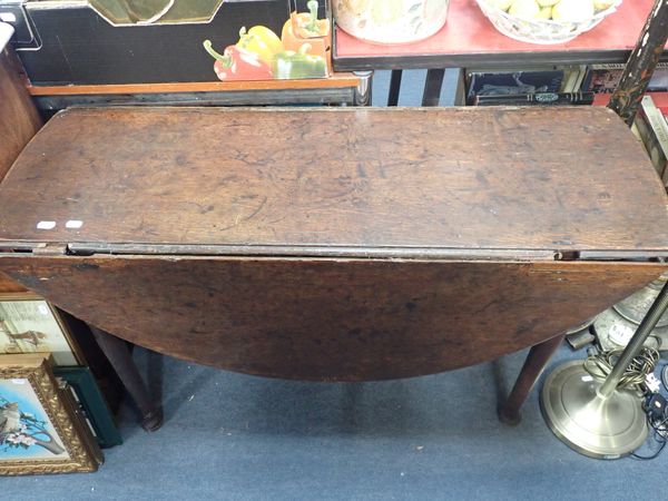 AN OAK PAD FOOT SUPPER TABLE