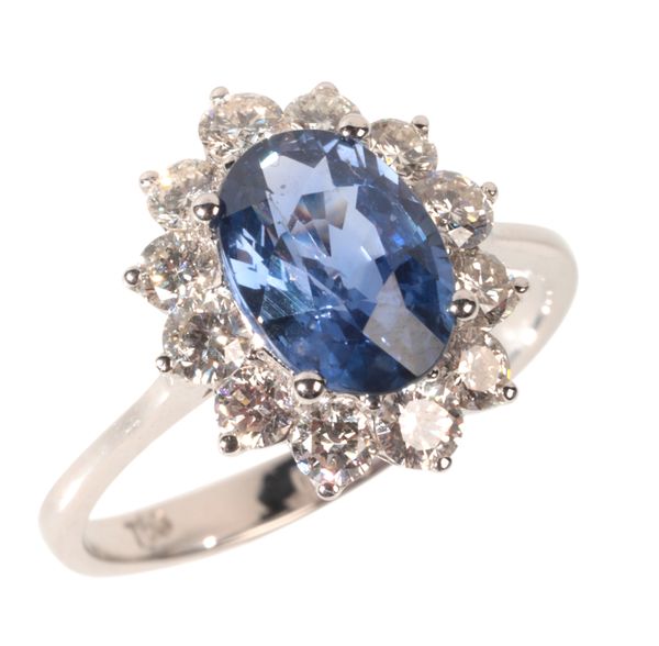 A SAPPHIRE AND DIAMOND CLUSTER RING