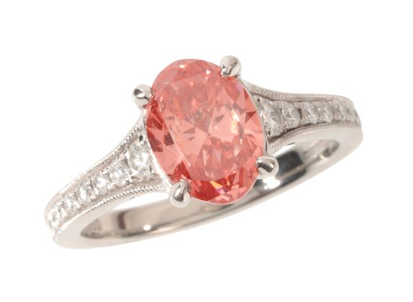 A TREATED PINK DIAMOND SOLITAIRE RING