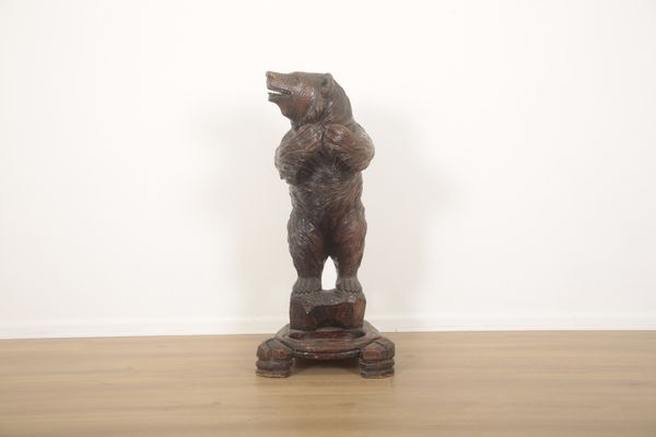 A BLACK FOREST CARVED BEAR STICK OR UMBRELLA STAND