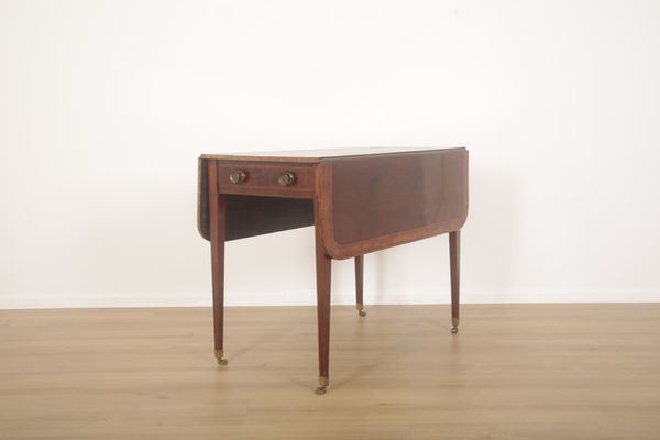 A REGENCY MAHOGANY AND CROSSBANDED PEMBROKE TABLE