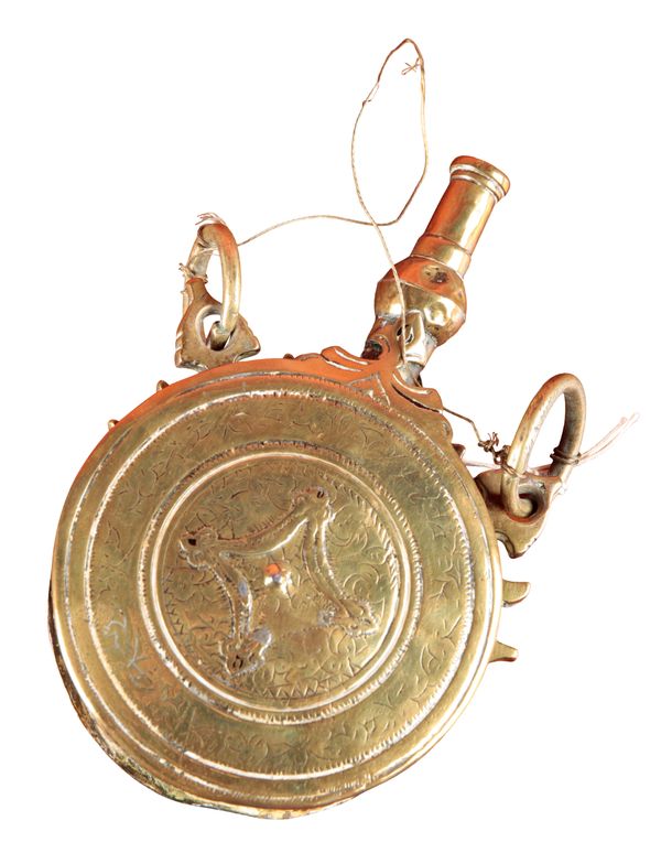 AN EASTERN BRASS POWDER FLASK