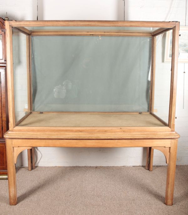 A MUSEUM DISPLAY CABINET ON STAND