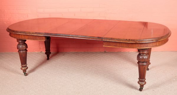 A VICTORIAN MAHOGANY WIND-OUT EXTENDING DINING TABLE