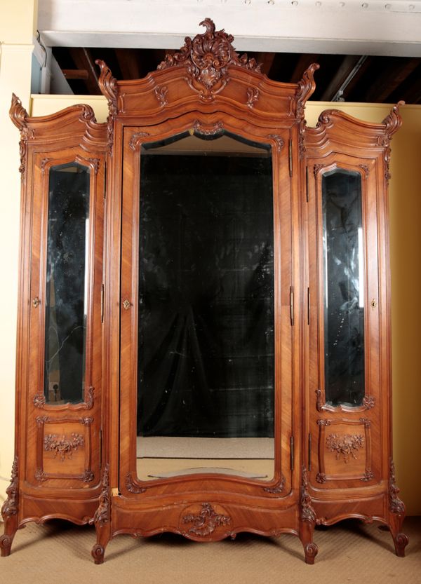 A FRENCH WALNUT TRIPLE WARDROBE