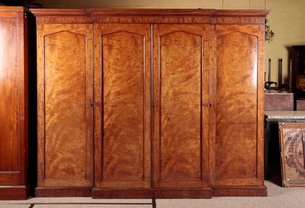 A VICTORIAN MAHOGANY BREAKFRONT TRIPLE WARDROBE