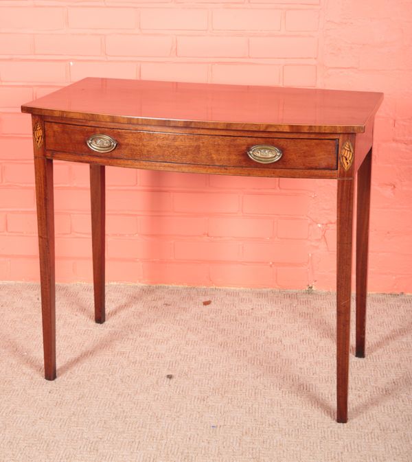 A GEORGE III MAHOGANY BOW FRONT SIDE TABLE