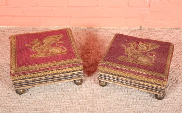 A NEAR PAIR OF REGENCY EBONISED AND PARCEL GILT FOOTSTOOLS