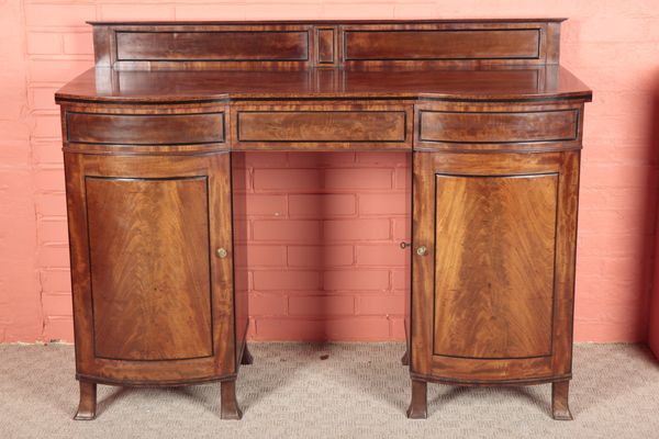 A REGENCY MAHOGANY AND EBONY BANDED PEDESTAL SIDEBOARD