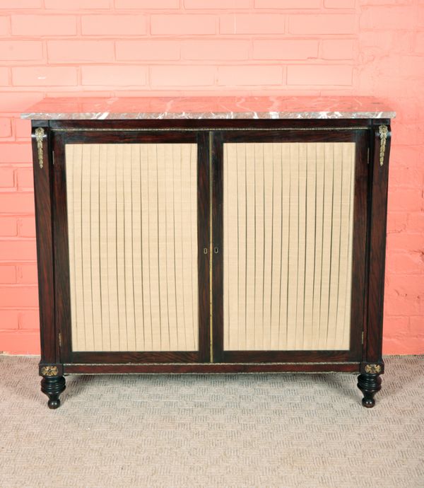 A REGENCY GRAINED WOOD AND GILT METAL MOUNTED SIDE CABINET