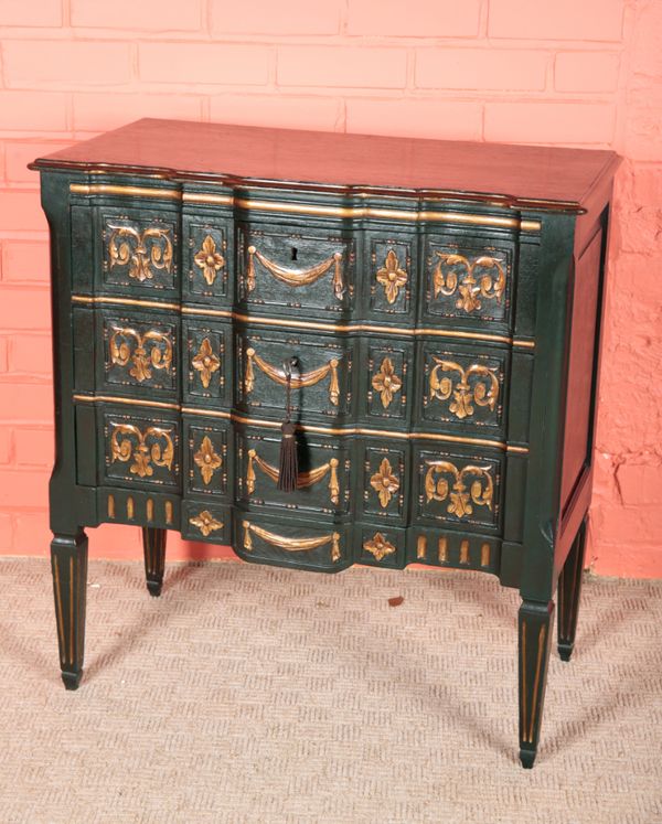 A CONTINENTAL GREEN PAINTED AND PARCEL GILT COMMODE