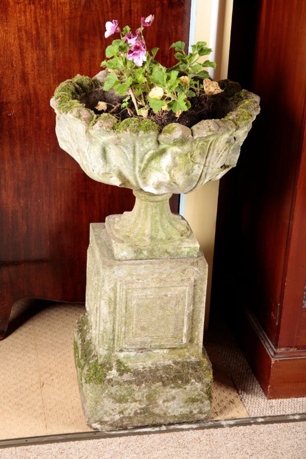 A CAST STONE PLANTER