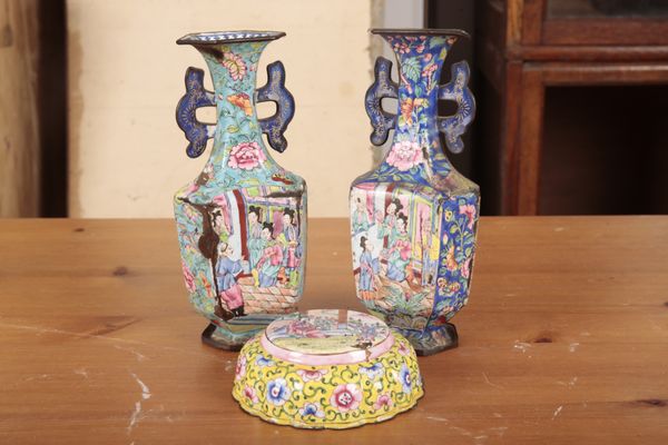 A MATCHED PAIR OF CHINESE ENAMELLED METAL TWO HANDLED VASES