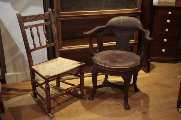 A 1920S REVOLVING OFFICE ARMCHAIR
