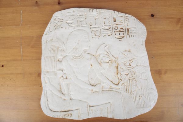 A DECORATIVE PLASTER PANEL OF EGYPTIAN DESIGN