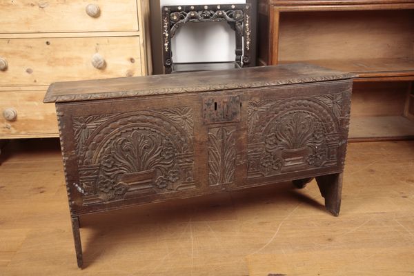A 17TH CENTURY PLANK COFFER