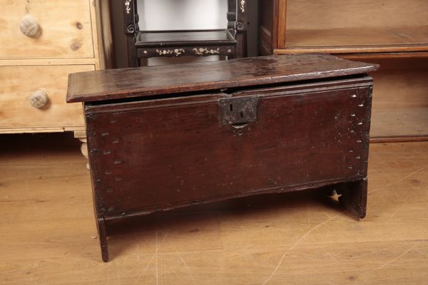 A 17TH CENTURY OAK PLANK COFFER OF SMALL PROPORTIONS