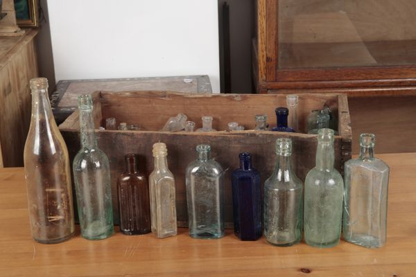 A PAINTED SHIP IN A CLEAR GLASS BOTTLE