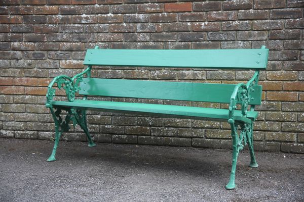 A CAST IRON AND FOUR PLANK GARDEN BENCH