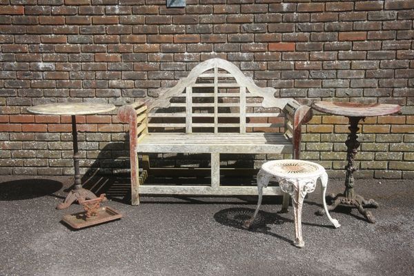 A WEATHERED TEAK LUTYENS STYLE SMALL BENCH