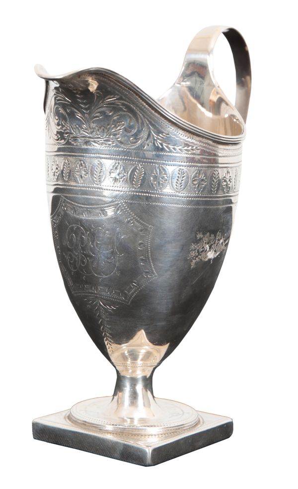 A GEORGE III SILVER CREAM JUG